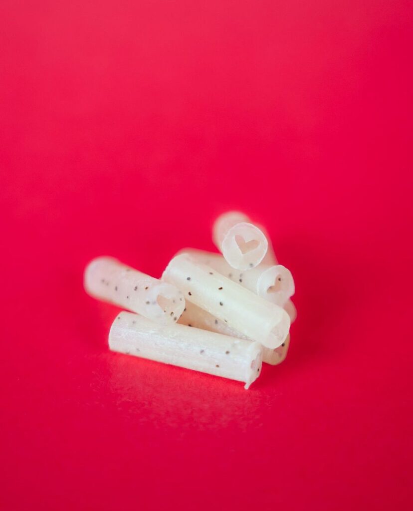 A Group/Pile of Bloomer Filter Tips, Red Background 