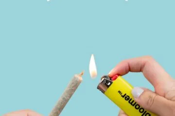 A person holding a Bloomer Lighter and Cone highlighting the Black Friday Sale/ Cyber Monday Sale for Bloomer.Store